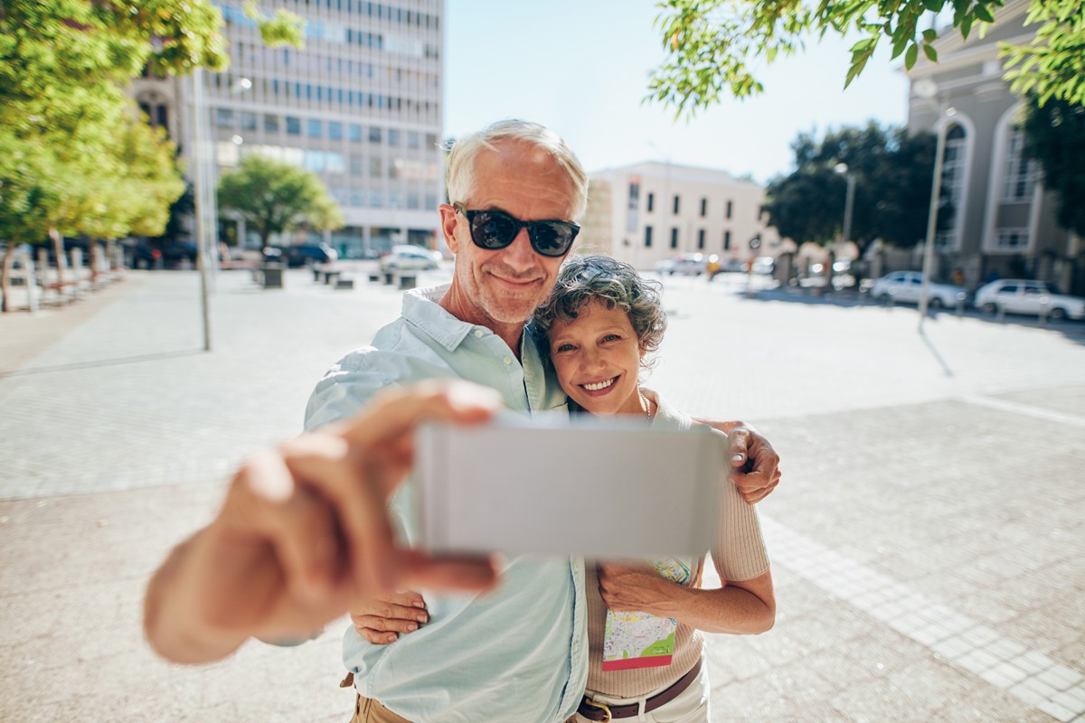 loving-senior-couple-taking-a-selfie-P9YFZLX